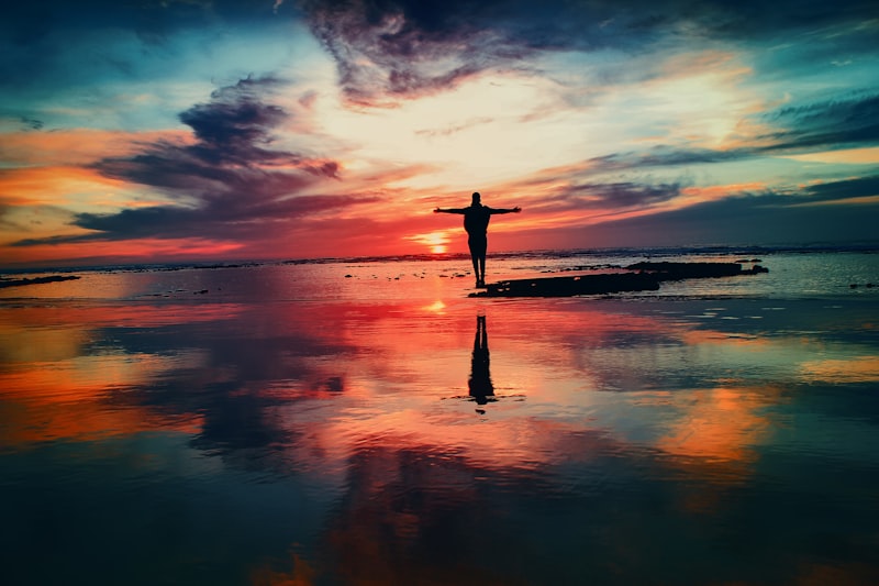 Hands lifted to sunrise